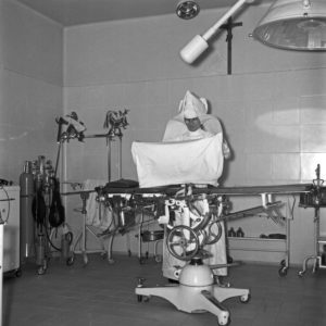 A hospital, run by nuns, here: a nun at her daily business, Germany 1950s. A hospital, run by nuns, here: a nun at her daily business, Germany 1950s.